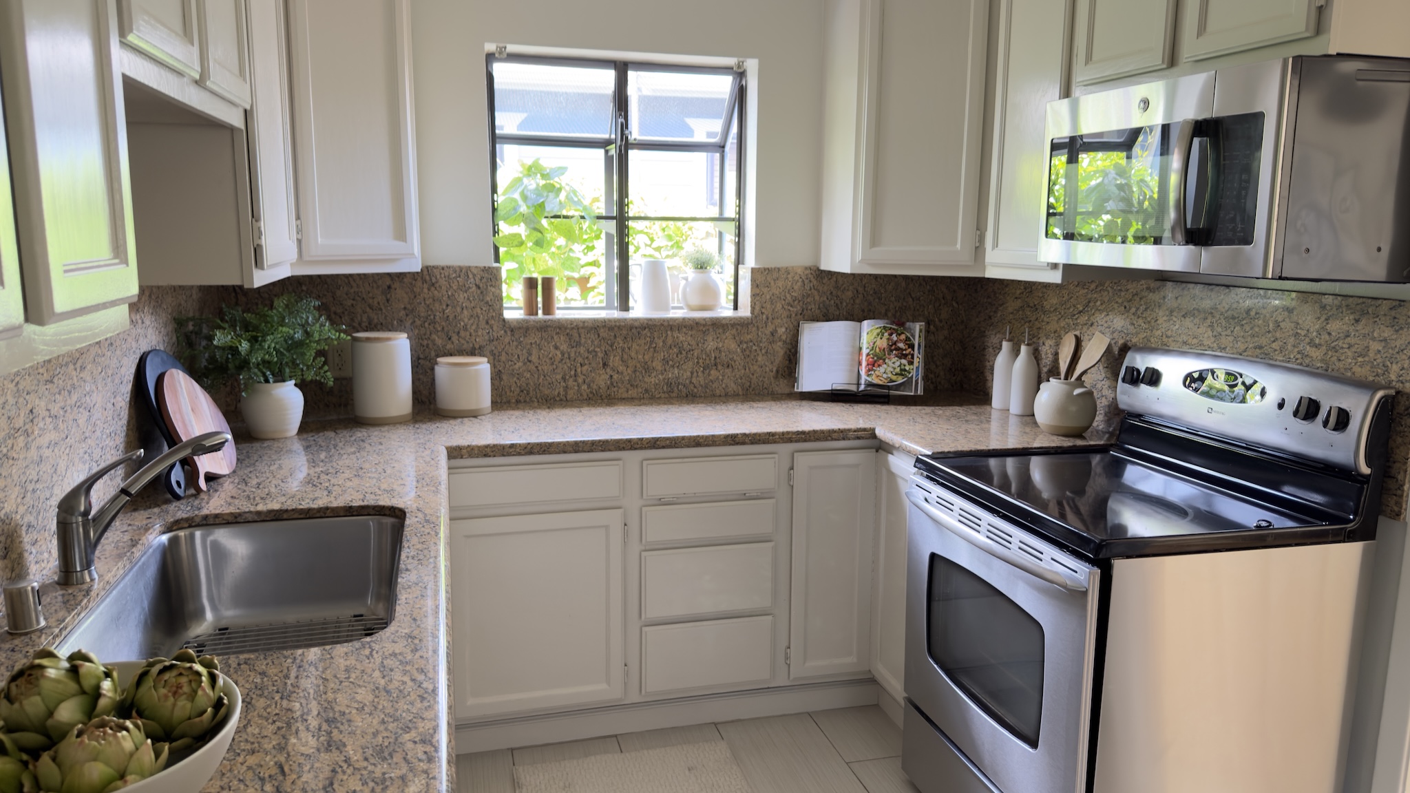 Kitchen with granite counters and stainless range